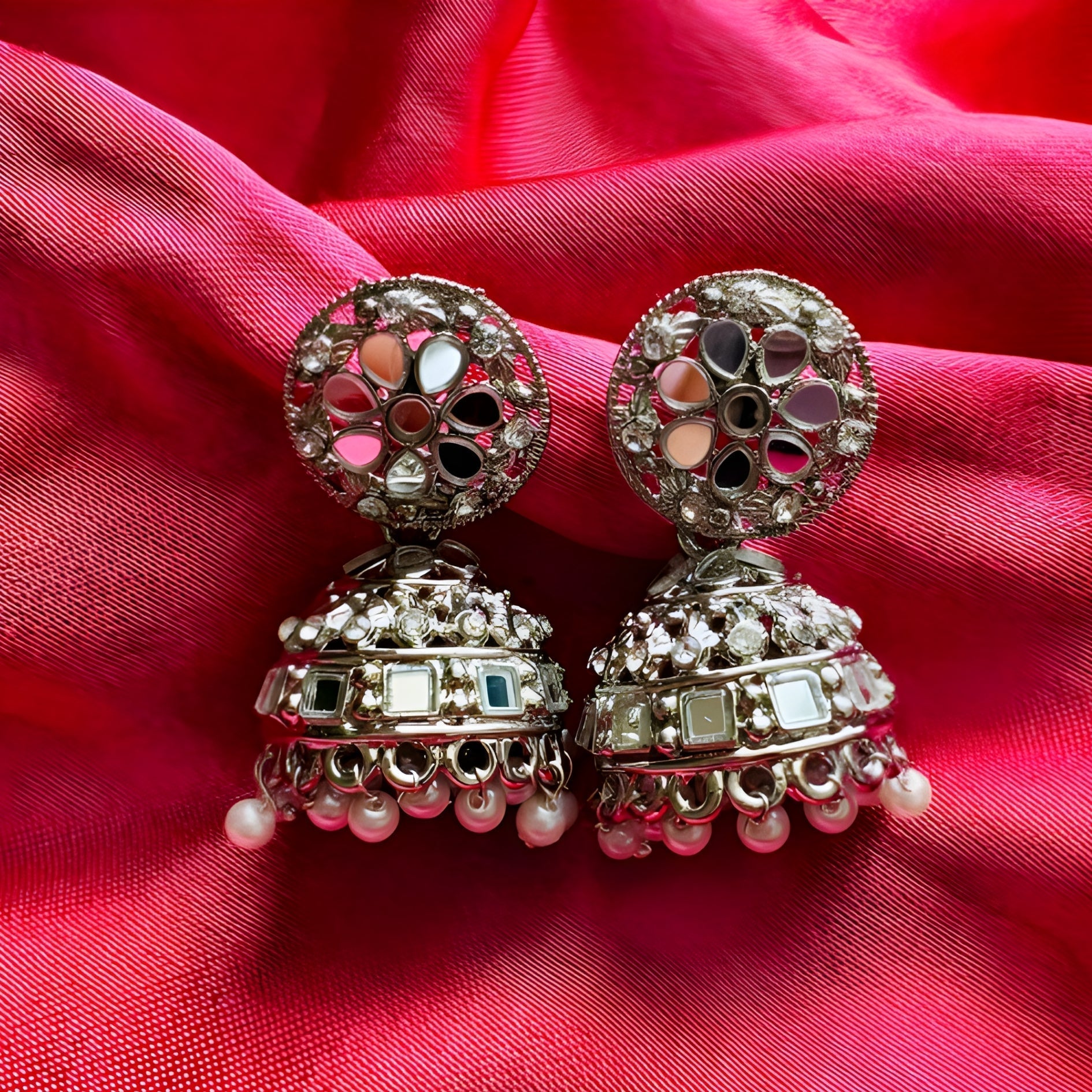 pair of oxidised silver mirror work jhumka earrings